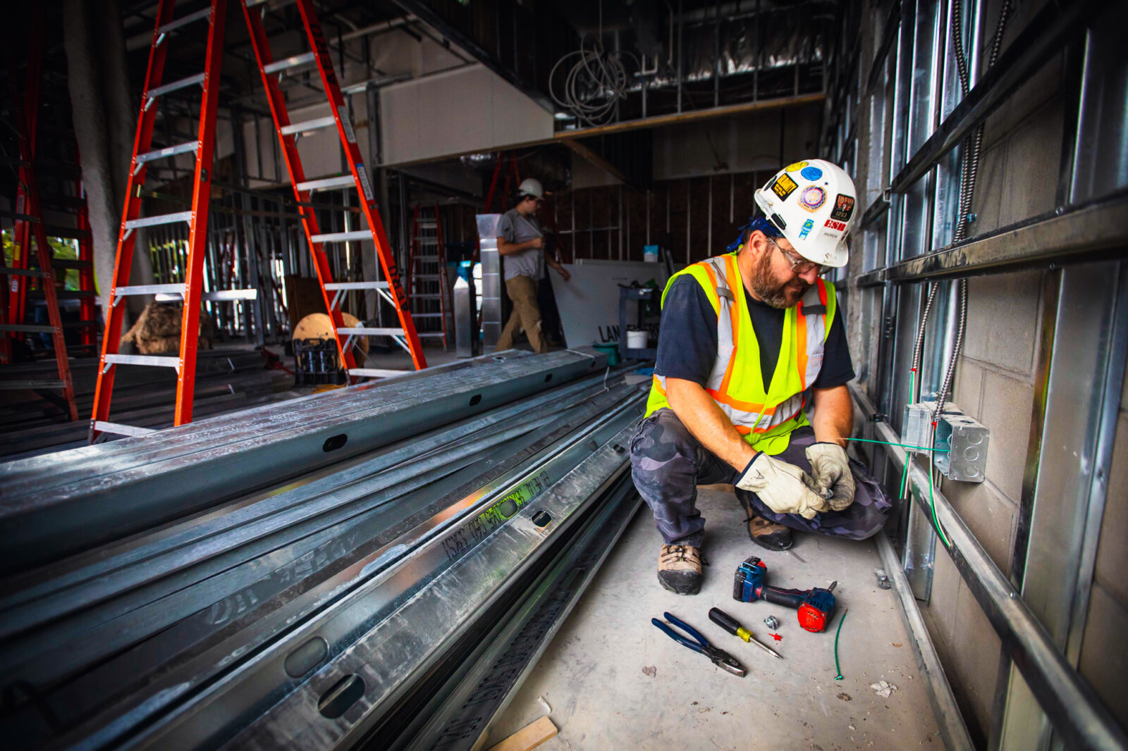 ESB worker performing electrical work in the interior of the facility