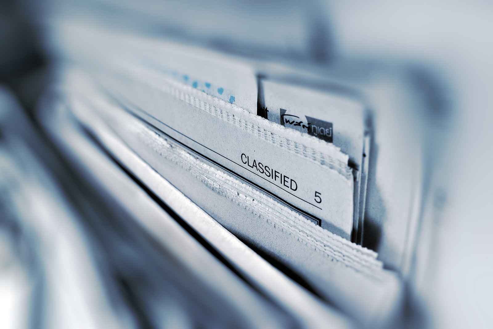 Close-up view of a newspaper with the Classified title