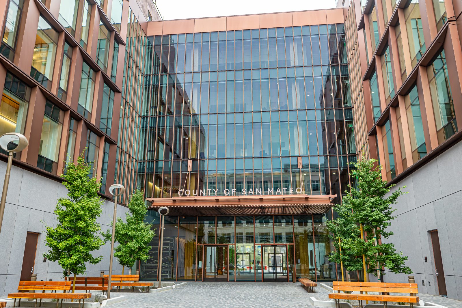 the outside of a building with lots of wood and windows